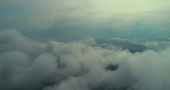 Aerial Fly Above Clouds with Blue Sky in Backgroubnd on Beautiful Sunny Day