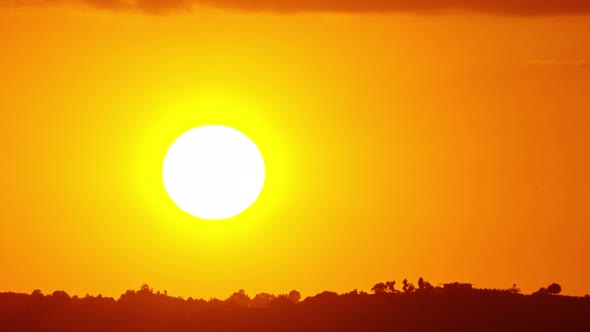 Time Lapse of the sun setting behind some mountains