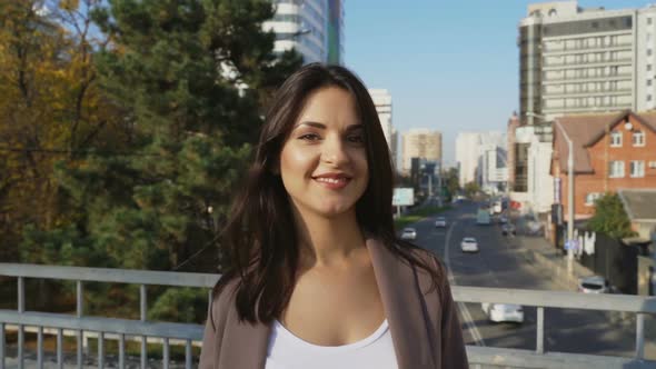 Beautiful Brunette Businesswoman In Business Clothes Walks