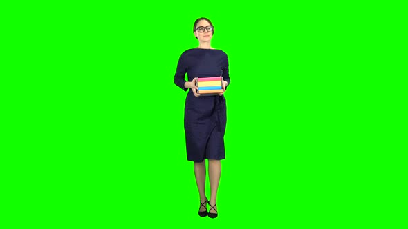 Student Goes To School with Books in Her Hands. Green Screen