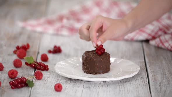 Decorating the Chocolate Ice Cream with Berries