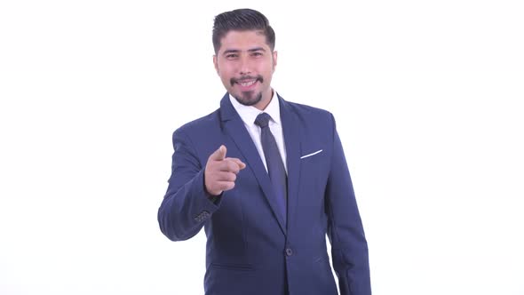 Happy Bearded Persian Businessman Pointing at Camera