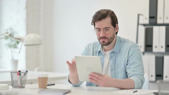 Young Man Using Tablet Work