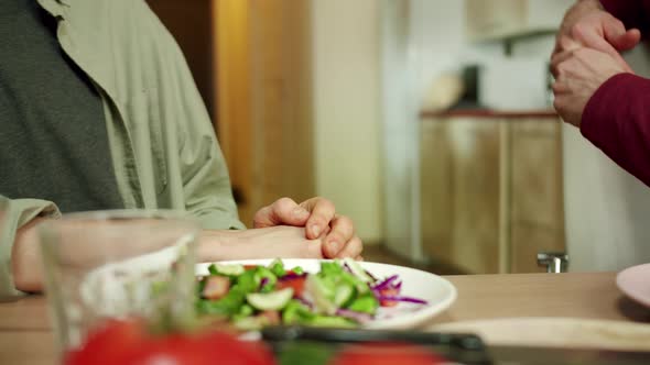 Two Men are Talking at Lunch in the Background