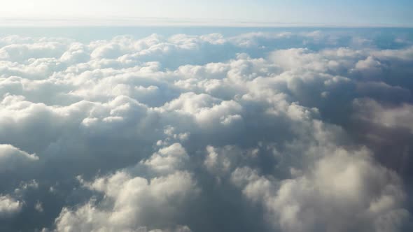 Flying Over Beautiful Clouds at Sunset. Amazing View