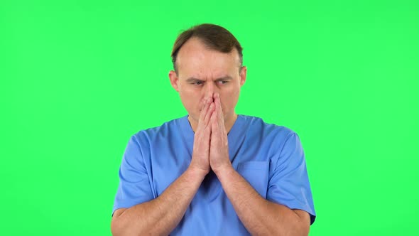 Medical Man Thinks About Something, and Then an Idea Comes To Him. Green Screen