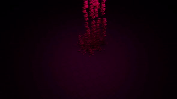 Falling bullets on a dark background