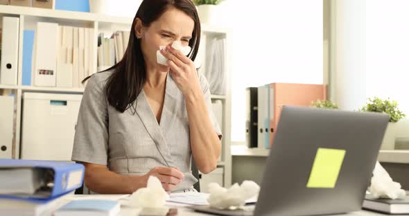 Woman Having Cold Sneezing with Runny Nose in Workplace Slow Motion  Movie