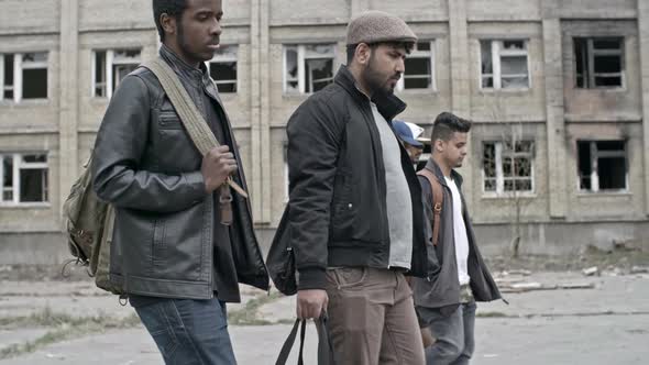 Arab Men Walking in Refugee Camp