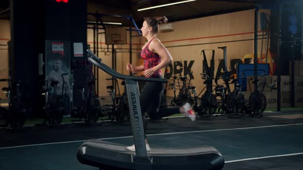 Woman athlete athlete is engaged in cardio training on the treadmill, thin beautiful sports girl