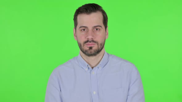 Portrait of Serious Man Looking at the Camera Green Screen