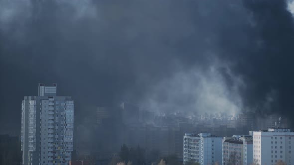 Black Smoke From Fires Blankets Highrise Apartment Buildings in the City