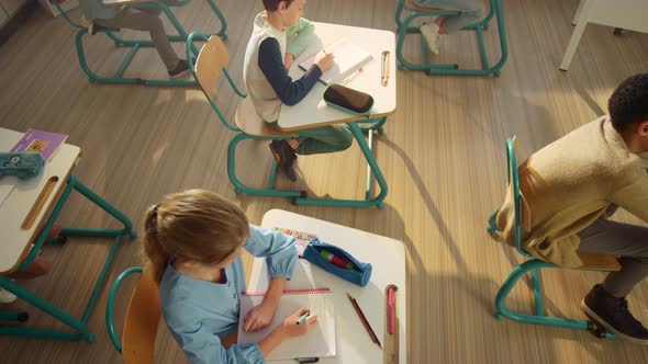 Pupils Sitting at Desks in Classroom