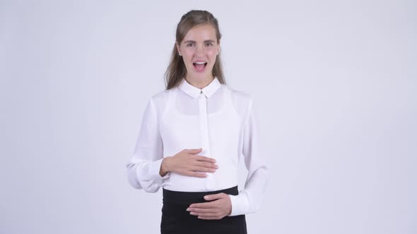 Young Happy Pregnant Businesswoman Looking Excited While Giving Thumbs Up
