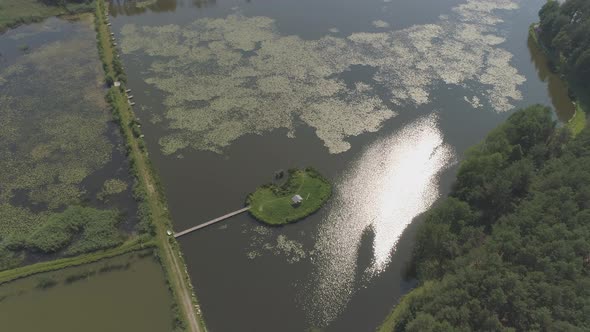 Aerial of a pond with a small island