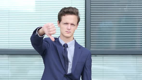 Thumbs Down Gesture by Young Businessman, Outdoor