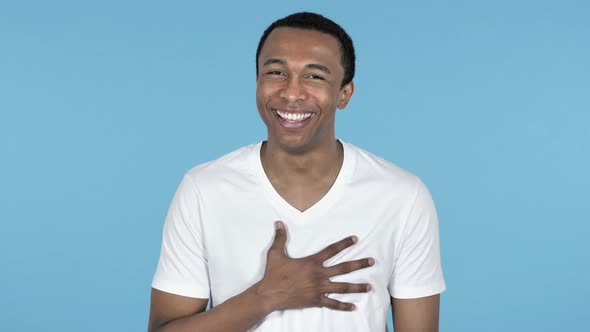 Funny Laughing Young African Man, Blue Background