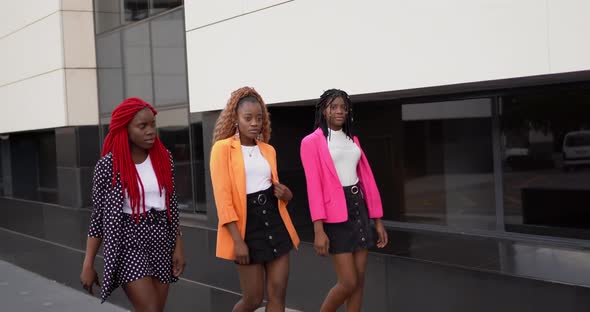 Black female friends doing model walk together