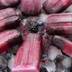 Homemade Fresh Frozen Blueberry and Blackberry Popsicles on Black Plate with Ice Sitting on Stone - VideoHive Item for Sale