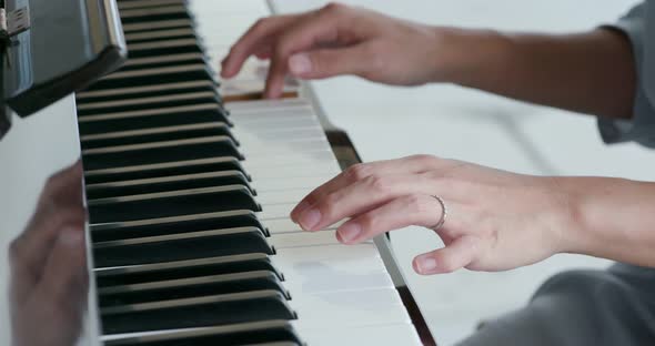 Woman play piano at outdoor