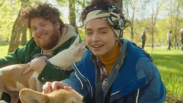 Portrait of Friends with Dogs in Park