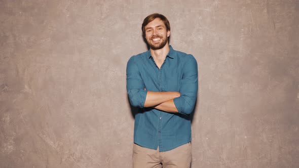 Portrait of young handsome man posing in studio