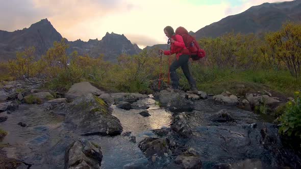 Girl Backpacking Along Scenic Hiking Trail