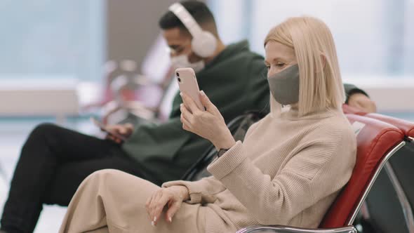 Woman Having Video Call In Departure Lounge