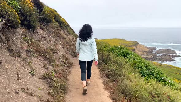 Asian Woman Hiking In Big Sur California