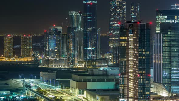 Aerial Skyline of Abu Dhabi City Centre From Above Night Timelapse