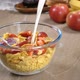 Milk Is Poured Into a Bowl of Cornflakes and Strawberries - VideoHive Item for Sale