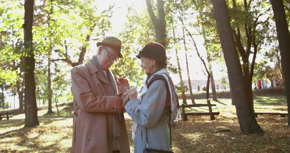 Senior Man Takes Wedding Ring Out of Pocket and Puts It on His Beloved's Finger