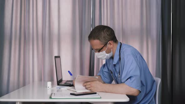 Doctor Writes with Ballpoint Pen Fills Medical Card