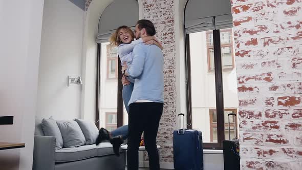 Couple Having Fun Together in their Beautifully Designeted Room in Contemporary Hotel