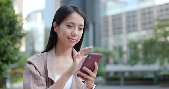 Young Woman Working on Cellphone at Outdoor