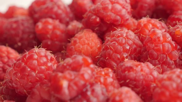 Pile of European raspberry red healthy fruit slow tilt  2160p 30fps UltraHD footage - Rubus idaeus  