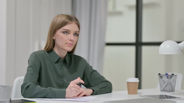 Pensive Young Woman Writing on Paper, Thinking 