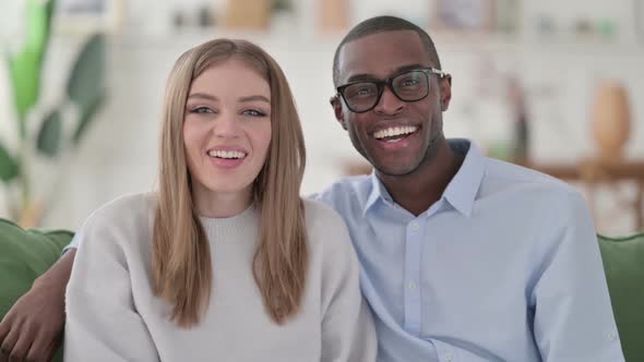 Mixed Race Couple Talking on Video Call at Home