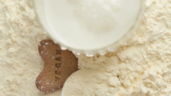 Protein powder and measuring scoop over the jar