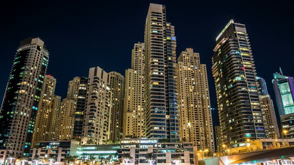 View of Dubai Marina Towers and Yahct in Dubai at Night Timelapse Hyperlapse