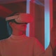 Young woman wearing goggles experiencing virtual reality in red neon lights - VideoHive Item for Sale