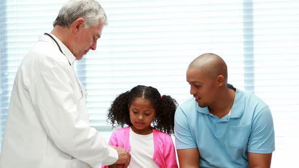 Male doctor examining patient