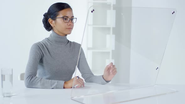 Asian Office Worker Using Invisible AR Interface