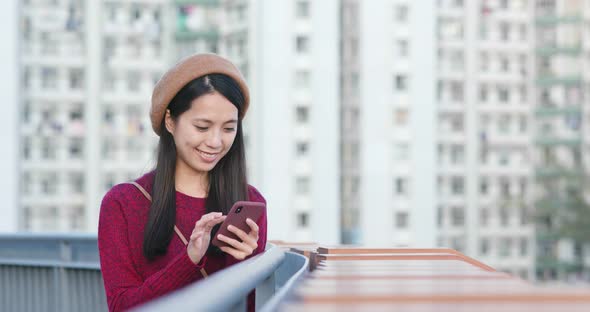 Woman Use of Mobile Phone in City