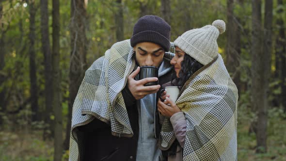 Young Happy Married Couple on Date in Nature Guy and Girl Lovers in Autumn Forest Embracing in Warm