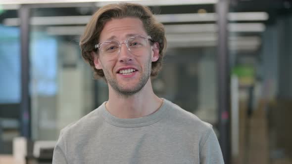 Portrait of Young Businessman Talking on Online Video Call