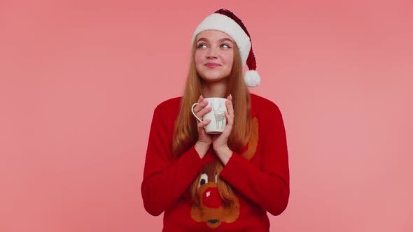 Cheerful Girl in Christmas Santa Sweater with Hot Drink Smiling Relaxing Drinking Coffee or Tea