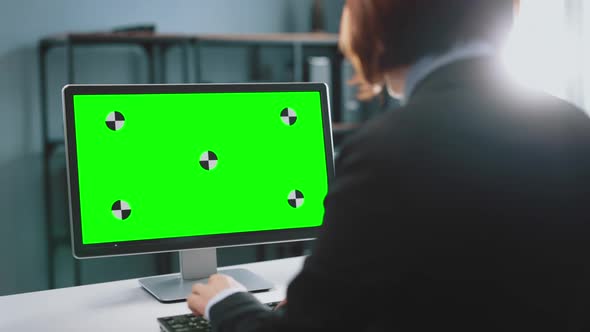 Business Lady Using Computer with Green Screen for Work