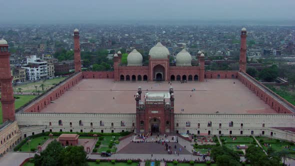 Lahore, Pakistan, Drone view of world famous Badshahi Mosque, Visitors are entering in the Mosque, P