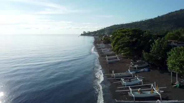 Fly along black sand beach